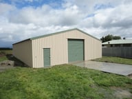 Enclosed shed with roller door