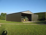 Implement shed with sliding door