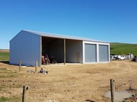 half enclosed and half open farm shed